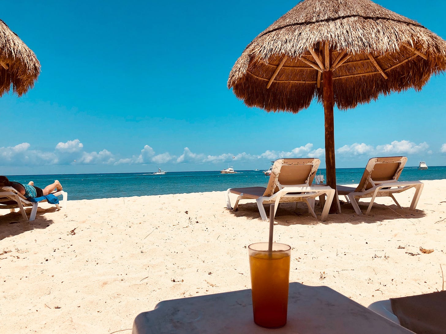 A beach with sun shades A beach with sun shades