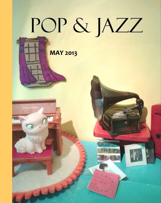 The cover of Pop & Jazz from May 2013 depicting a diarama of a cat interested in LP records