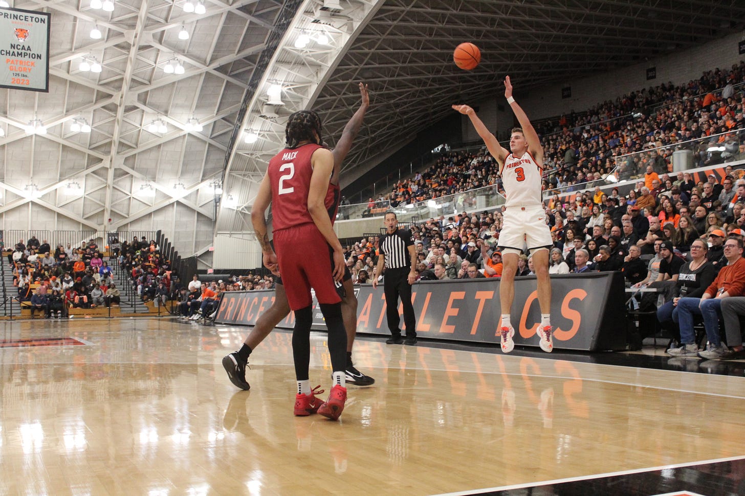 Caden Pierce tries a 3-pointer for Princeton during an 89-56 win over Harvard on Jan. 6, 2024. (Photo by Adam Zielonka)