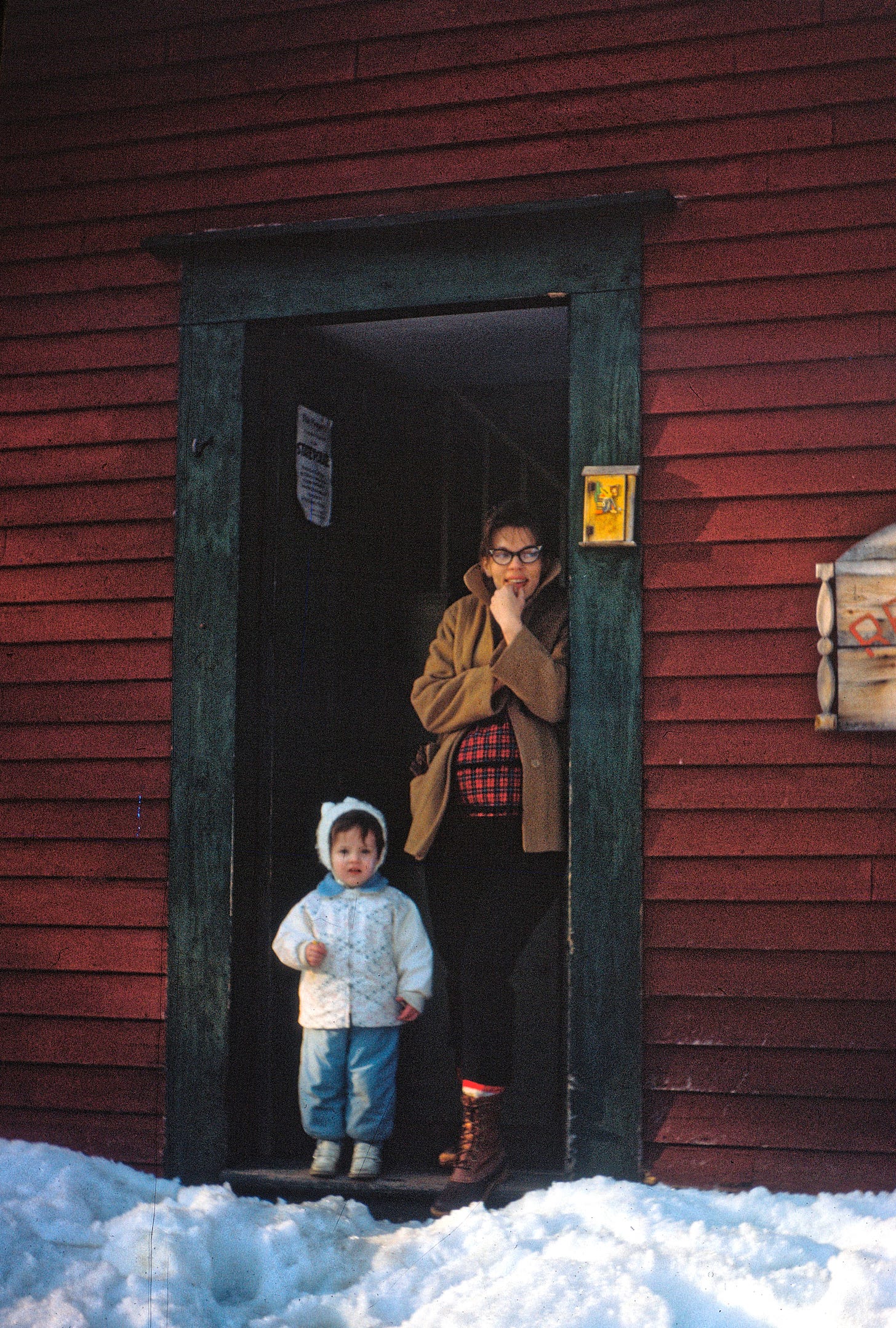 Woman with child in doorway