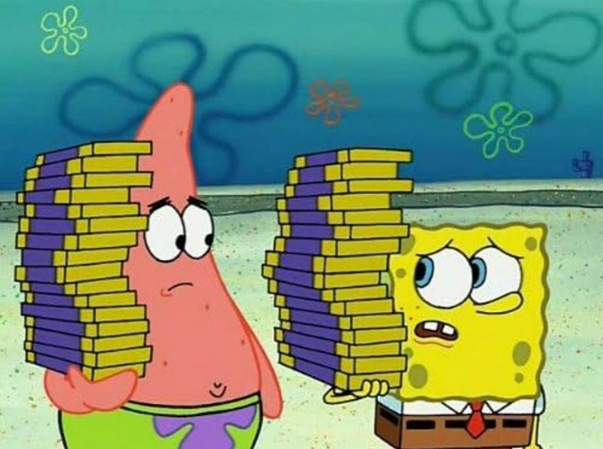 Image of SpongeBob SquarePants and Patrick Star exchanging concerned looks while holding teetering towers of chocolate bars | Paramount Global