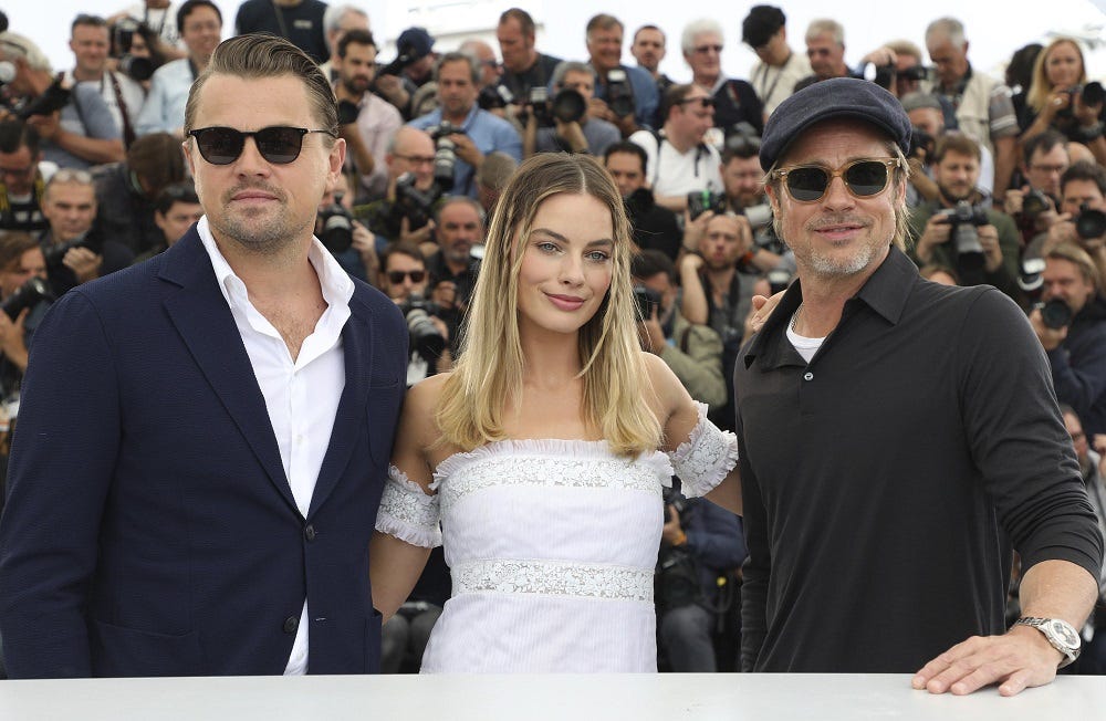 leonardo dicaprio margot robbie with brad pitt at cannes 2019