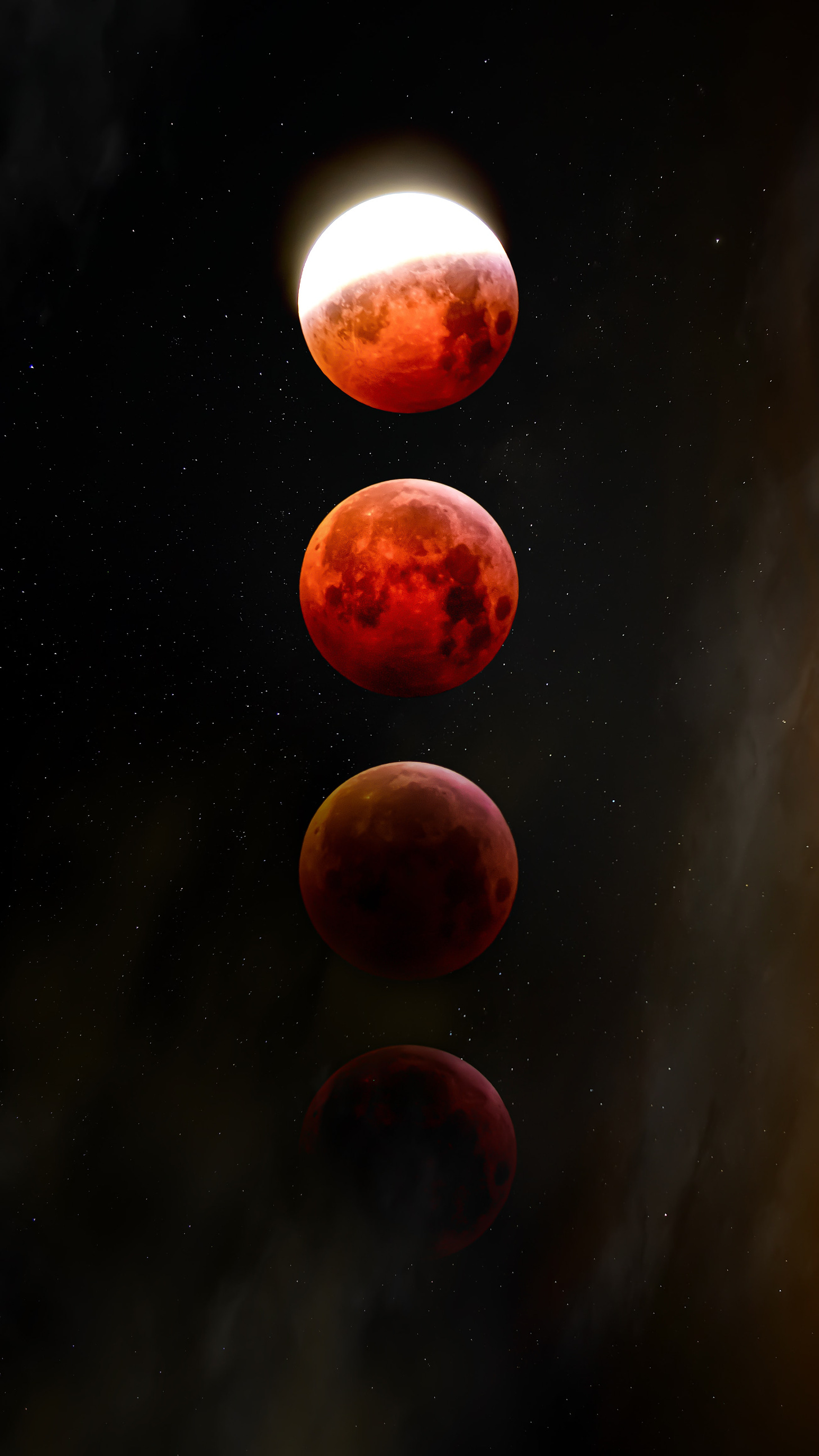 A vertical composite of the moon going through several stages of a lunar eclipse, starting partially illuminated at the top, then turning red, and then darkening.
