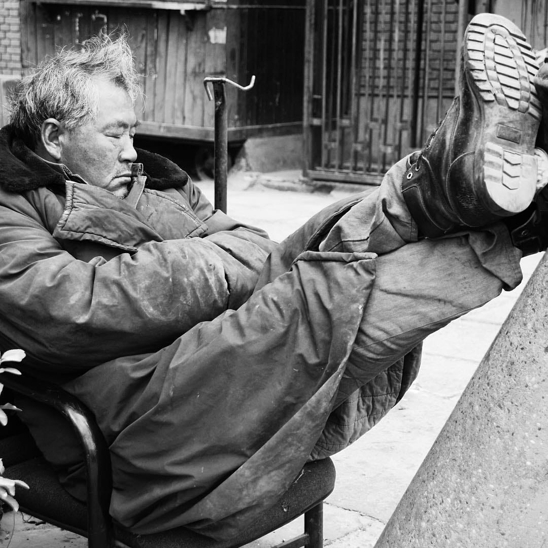 A moment of rest in the streets of Beijing.