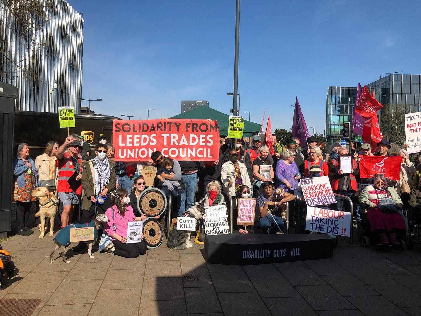 May be an image of 8 people, crowd and text that says "HATANt WARFARE O WELFIR nARTA SOLIDARITY FROM LEEDS TRADES UNION COUNCIL TAX DONT THE Hand CUTS KILLI WISTES GAINST 1018/11 NOT SHIRKING SCROUNCINE SCROU DISABLED LABOUR THEDIŠ!! UCANHANE DISABILITY"