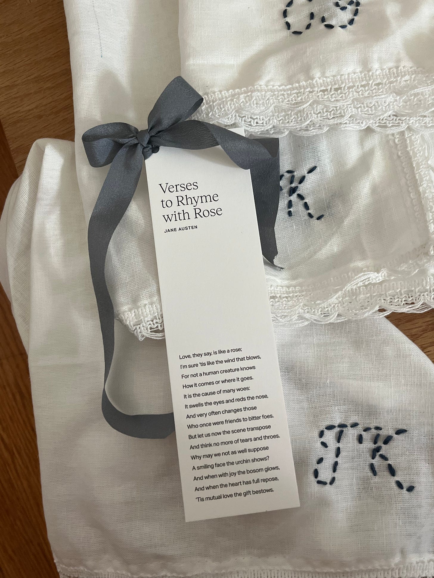 A bookmark tied in a bow with "Verses to Rhyme with Rose" printed on it.