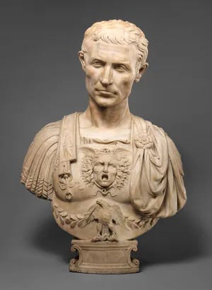 A marble bust of Julius Caesar, former Roman Emperor and boy boss.