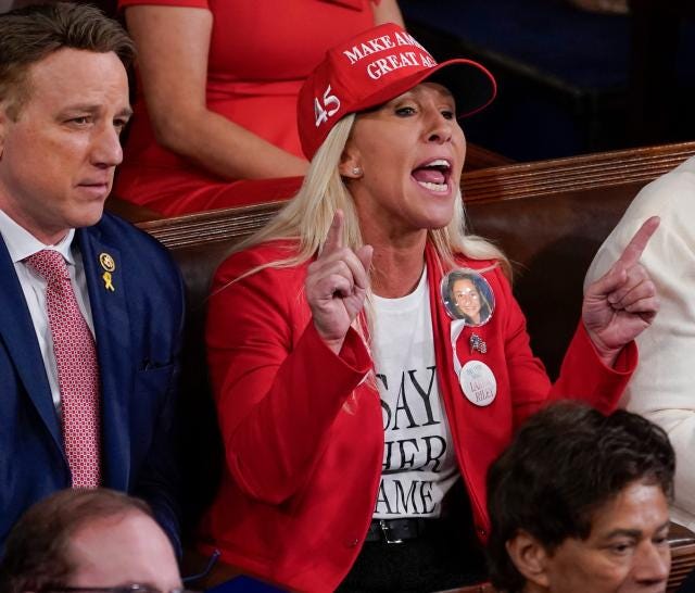 Biden's reaction to Rep. Marjorie Taylor Greene's MAGA garb at SOTU goes  viral