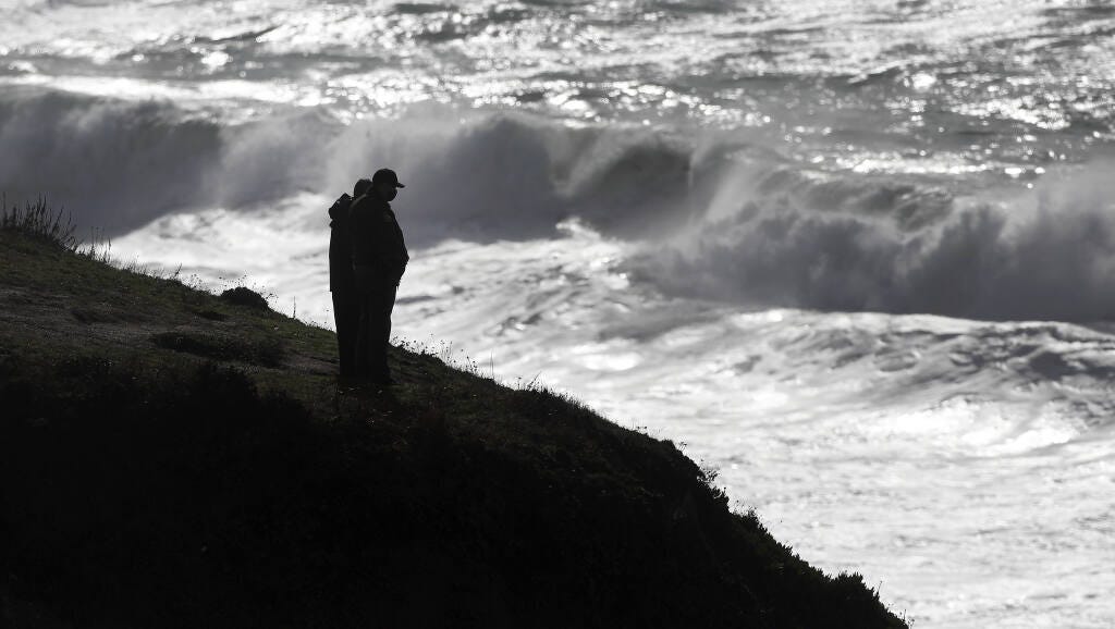 Volunteers, Monday, Jan. 4, 2020, scan the surf line above Blind Beach as they search for two missing children that were swept away but rough seas Sunday afternoon which claimed the life of their father. (Kent Porter / The Press Democrat) 2021