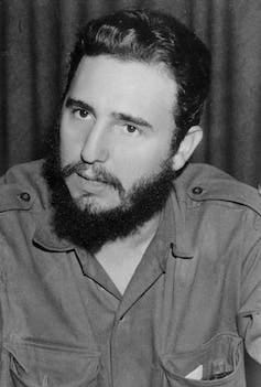 A black and white photograph of a bearded Fidel Castro.