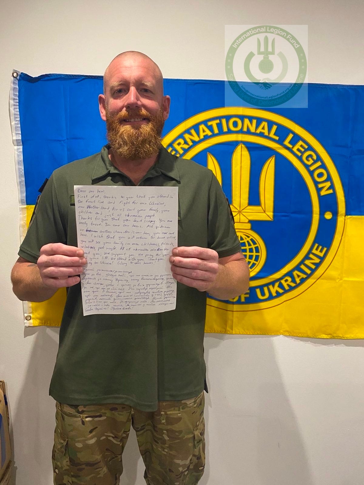 Legion soldier, call sign “Red”, reads a letter from a student at UCU