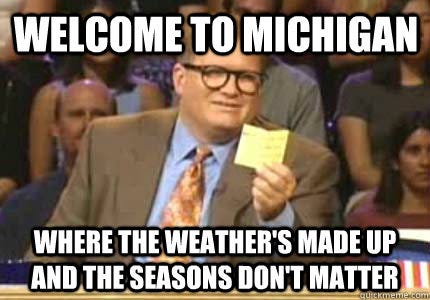 An image of drew carey holding a note card. Behind Drew is a crowd of people sitting in a studio. Above Drew's head it says "Welcome to Michigan"