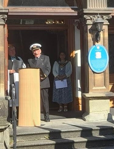 CAPTAIN DAVID KETTLETY, MNA (WALES) GIVING READING