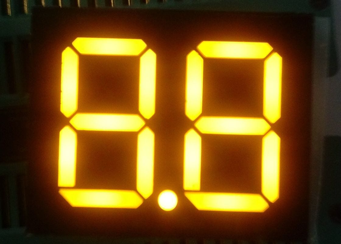 Yellow segment display with two digits.