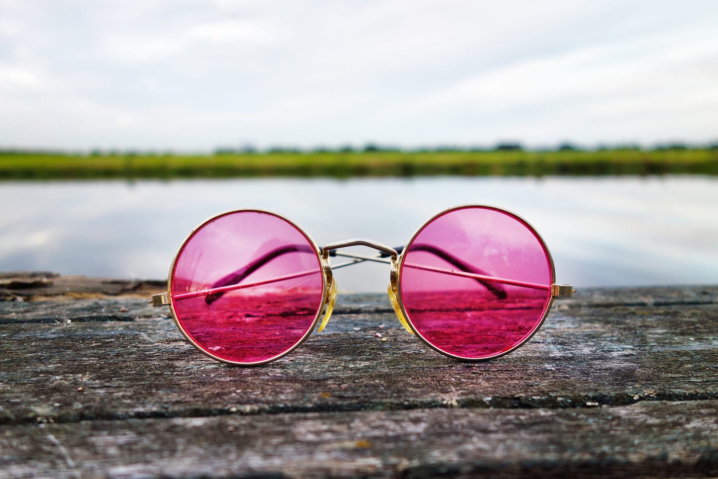 Pir of pink tinted round glasses