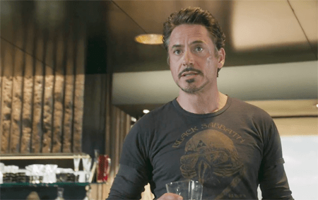 a screen cap from the Avengers of Tony Stark in a Black Sabbath t-shirt