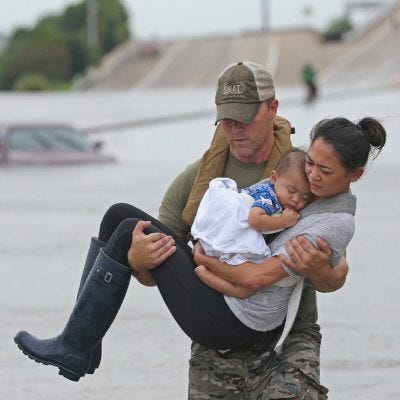 Swat Officer Rescuing Woman & Baby From The Aftermath Of Hurricane Harvey, 2017