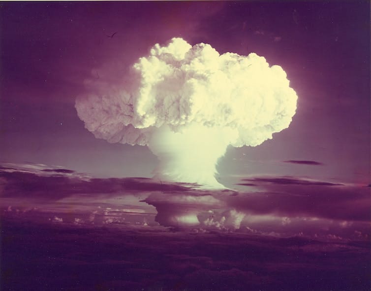 A large mushroom cloud captured on old film cameras