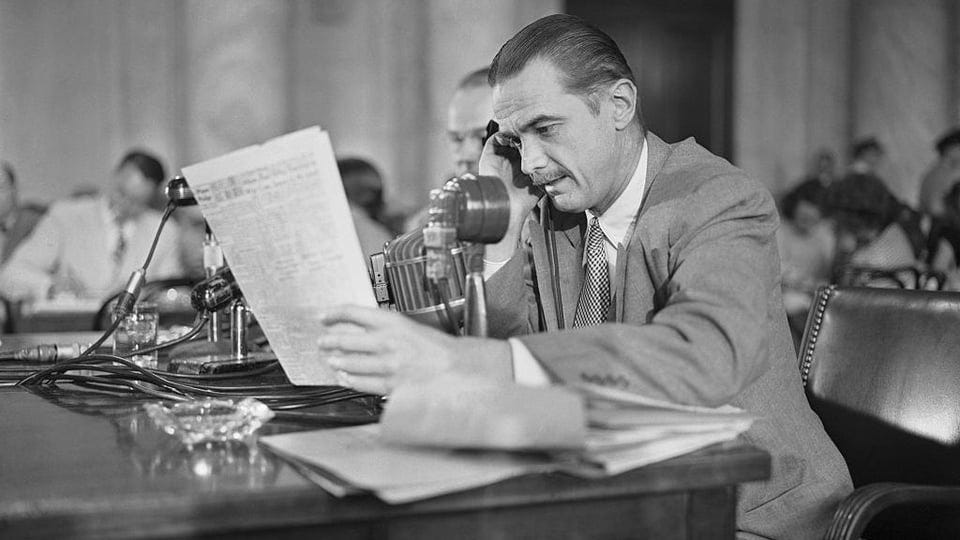 r/Kaiserreich - Howard Hughes on the phone and looking at a paper