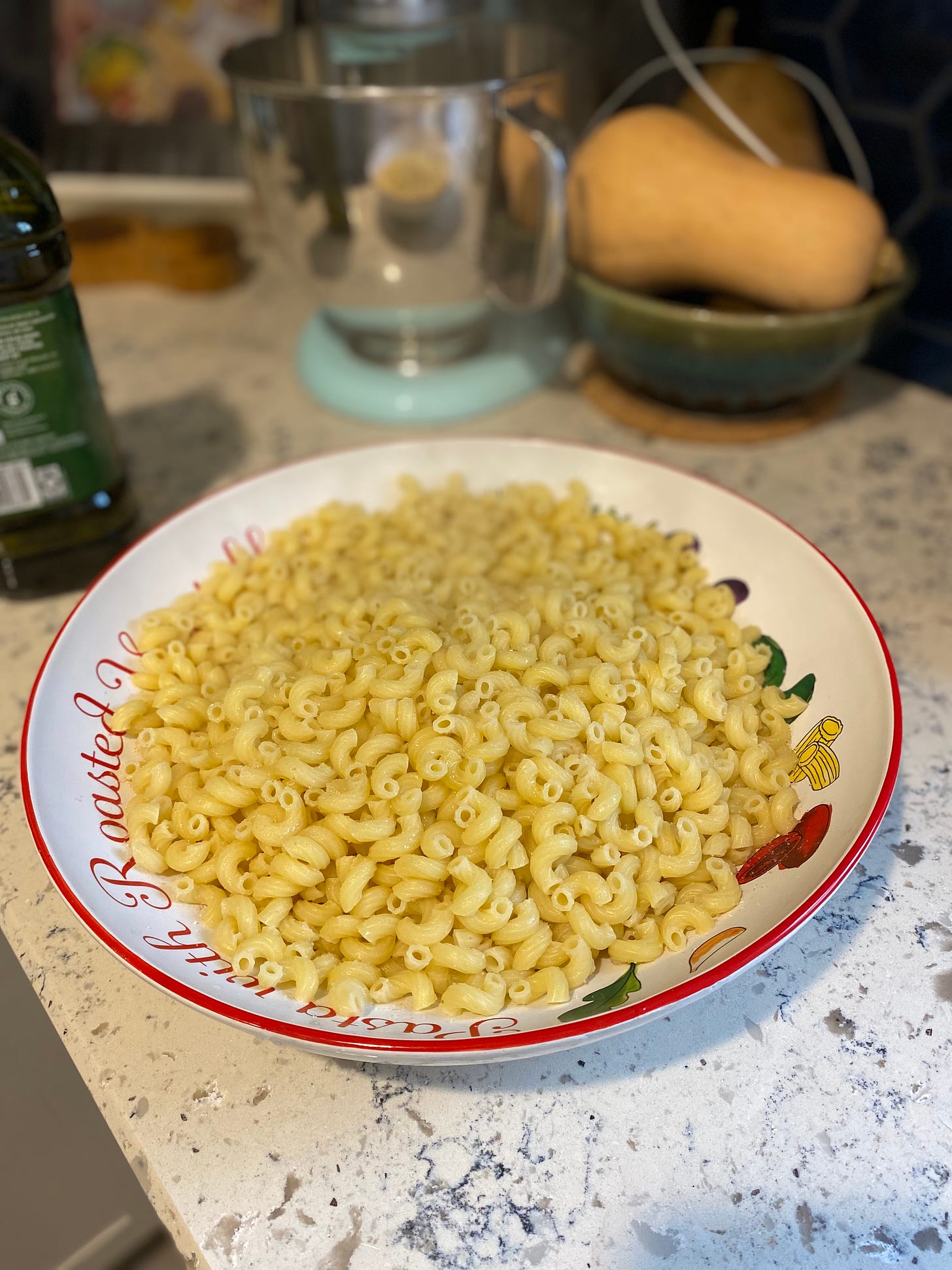 large bowl of macaroni pasta on countertop