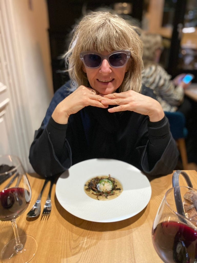 Woman with tinted glasses with a meal