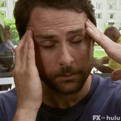 Gif of Charlie Day in It's Always Sunny In Philadelphia rubbing his temples
