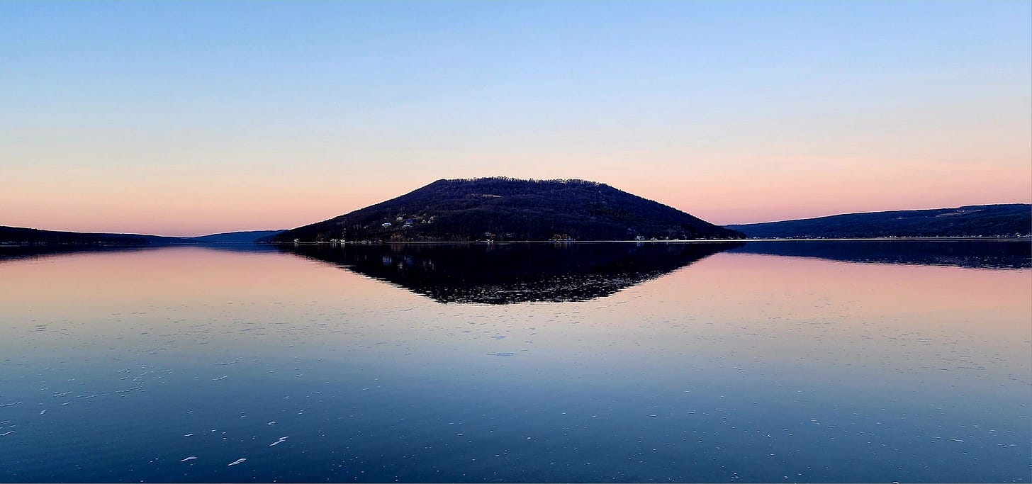 May be an image of lake, twilight, horizon and nature