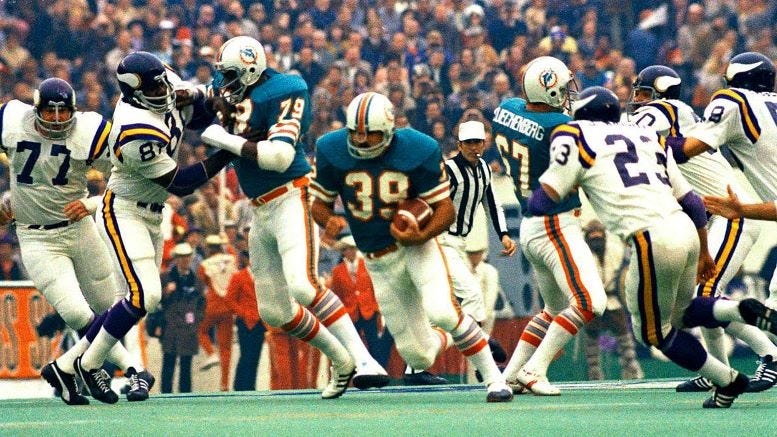 Larry Csonka running behind the Miami Dolphin offensive line during Super Bowl VIII.