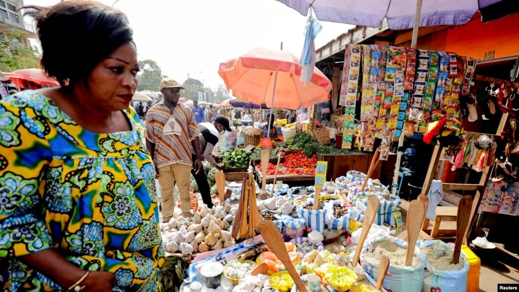 FILE - A woman shops at the Mvog Ada market in Yaounde, Cameroon, Jan. 29, 2022. During a protest on March 8, 2023, women asked the government to help them cope with price increases.