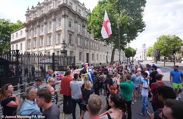 Protesters outside Downing Street in London in July protesting the arrest of Robinson for the 'frustration' of a port stop at the Channel Tunnel at Folkestone