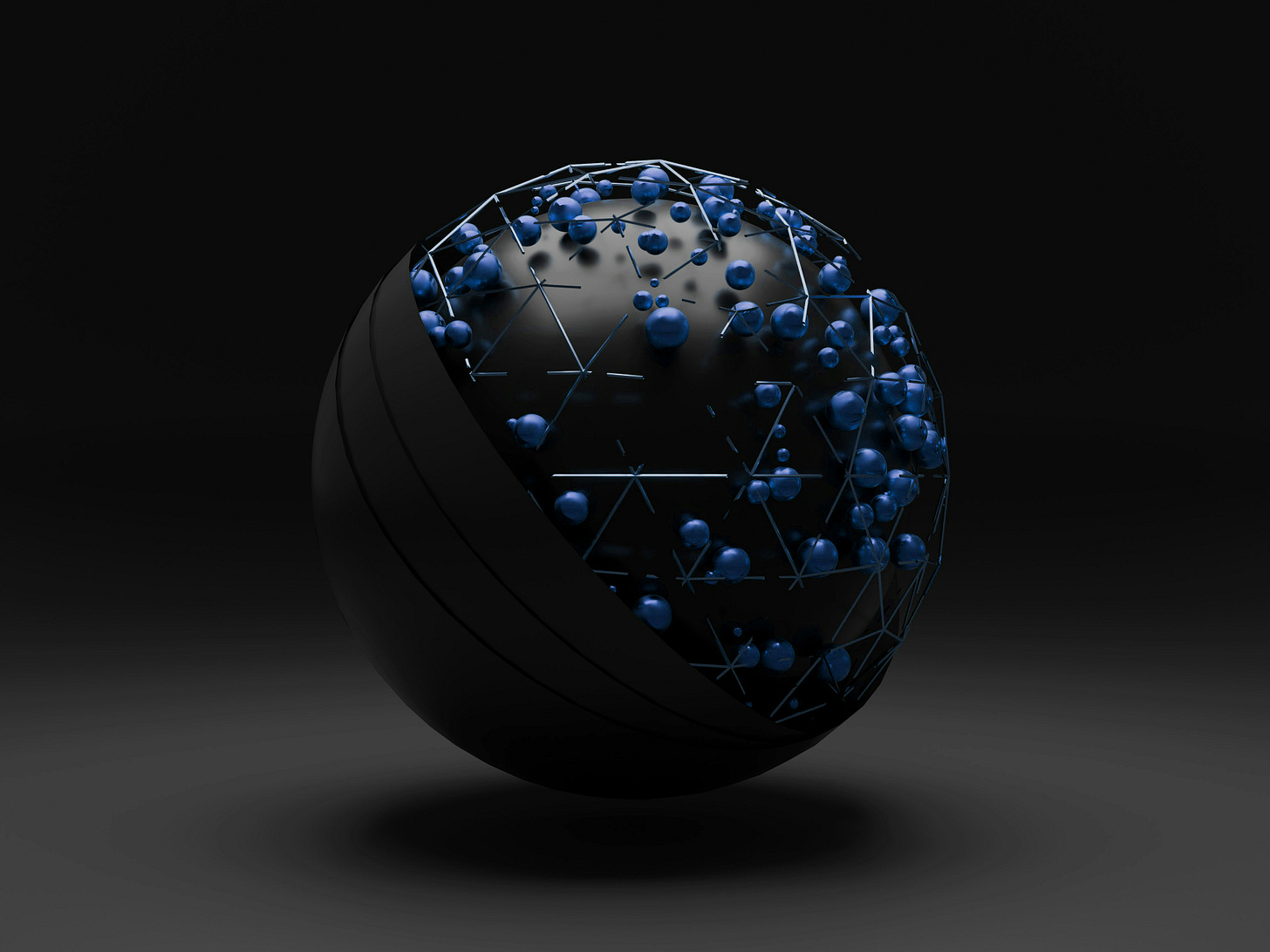 a black sphere cartoon floats in a black space. the sphere is made of smaller blue marbles (like protons in an atom?)