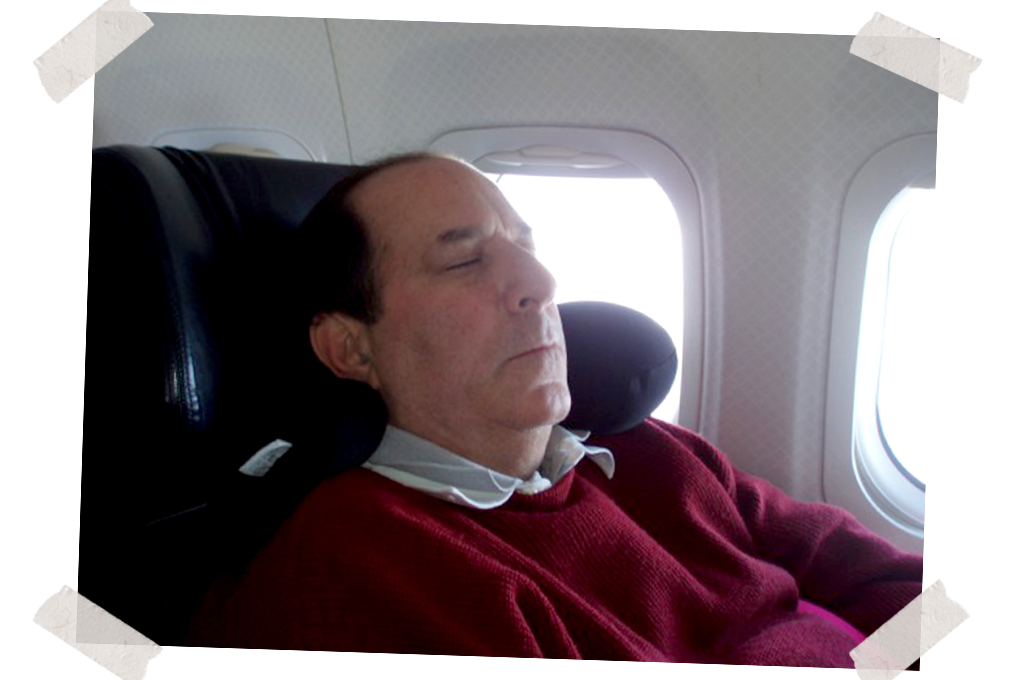 Dad asleep in seat 1A, the left hand front seat, early 2000s.