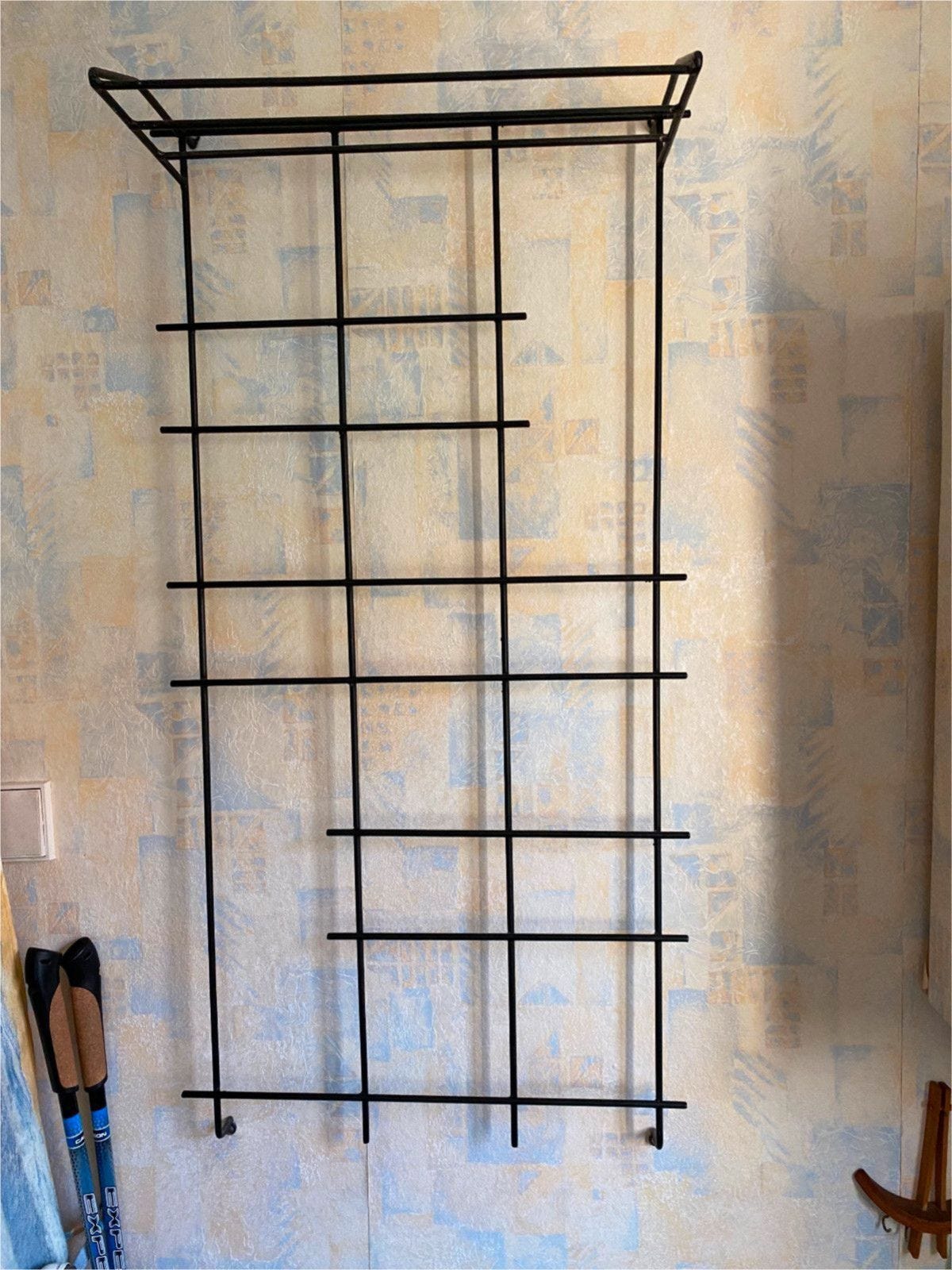 A string wardrobe attached to a wall.