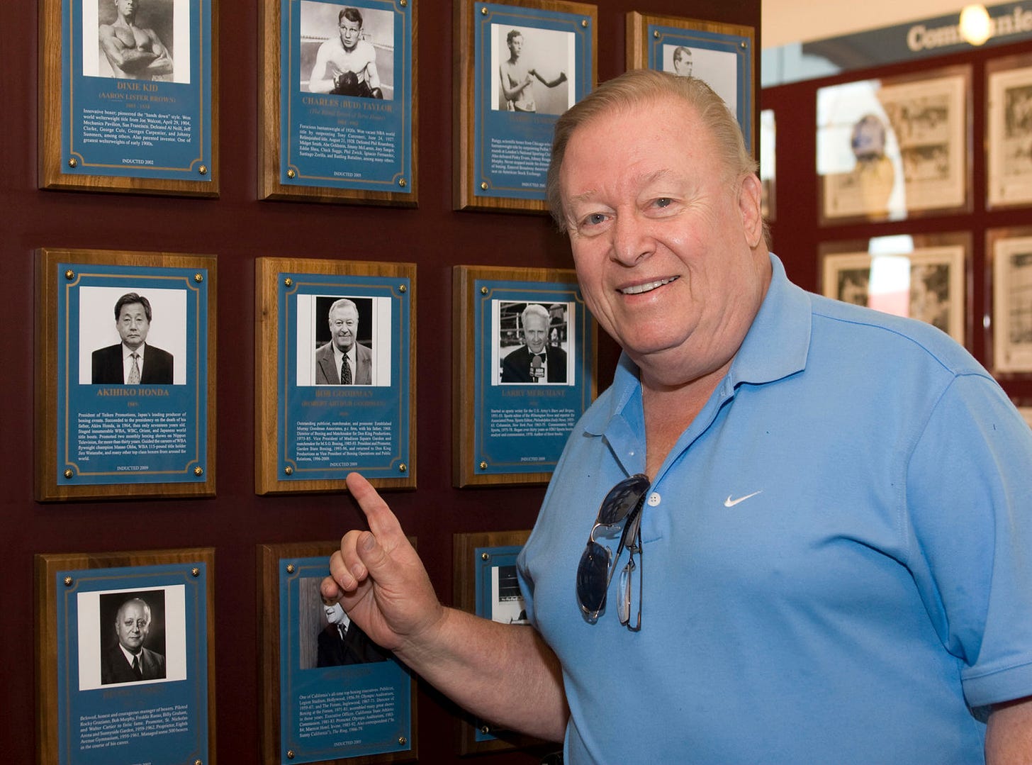Hall of Fame boxing matchmaker and publicist Robert “Bobby” Goodman, who promoted two major Muhammad Ali fights in the 1970s, has died. He was 83. Pictured is 2009 International Boxing Hall of Fame inductee Goodman by his plaque on the Hall of Fame wall in Canastota.