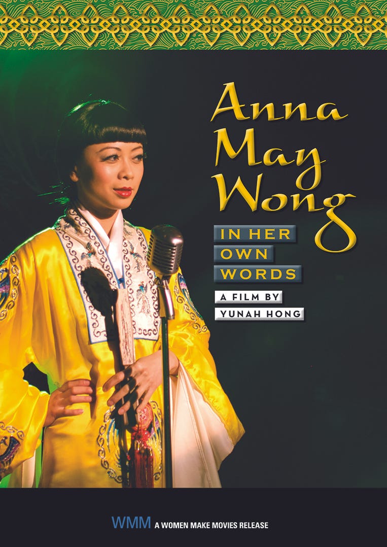 DVD cover pictures actress Doan Ly dressed as Anna May Wong in a yellow Chinese silk robe, standing in front of a microphone