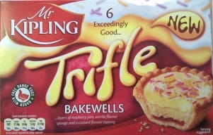 a box of Mr Kipling trifle bakewell puddings in jaunty red packaging