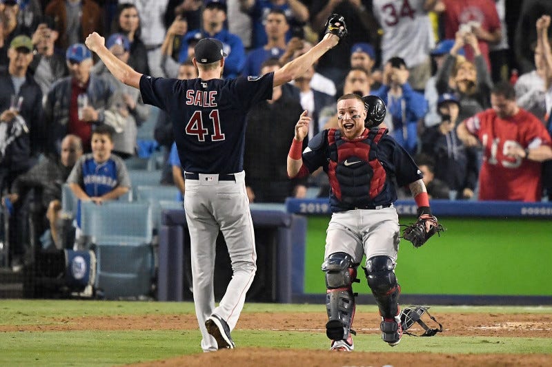 LOS ANGELES, CA - OCTOBER 28:  Christian Vazquez #7 jumps into the arms of Chris Sale #41 of the Boston Red Sox to celebrate their 5-1 win over the Los Angeles Dodgers in Game Five to win the 2018 World Series at Dodger Stadium on October 28, 2018 in Los Angeles, California.  (Photo by Kevork Djansezian/Getty Images)