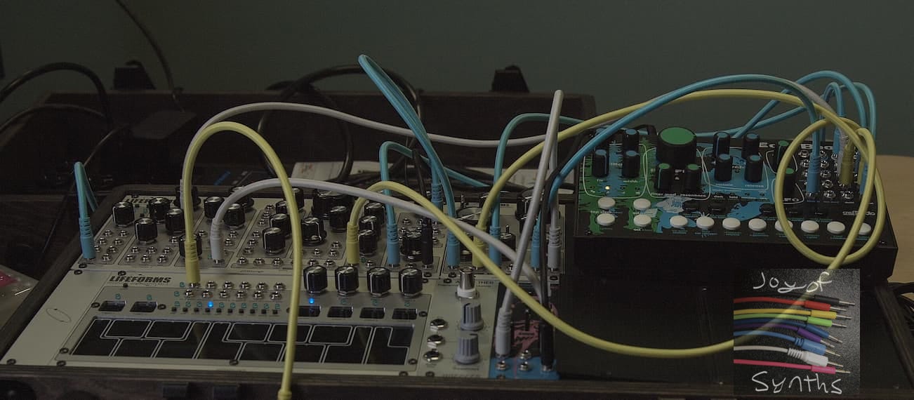 Cables connected to modular synthesizer