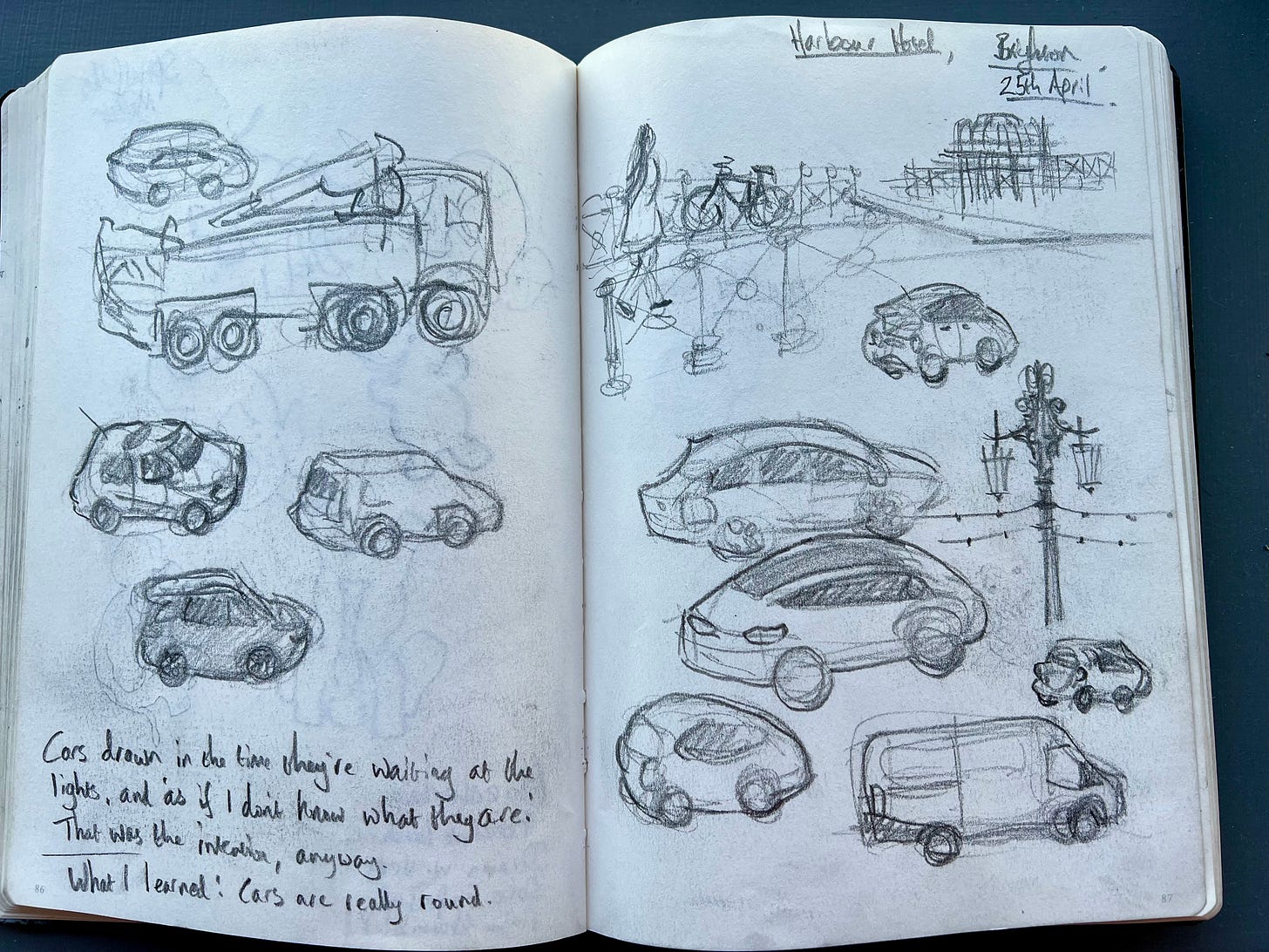 Little blobby pencil sketches of cars. Also one van, one lorry, and a ruined pier. 
