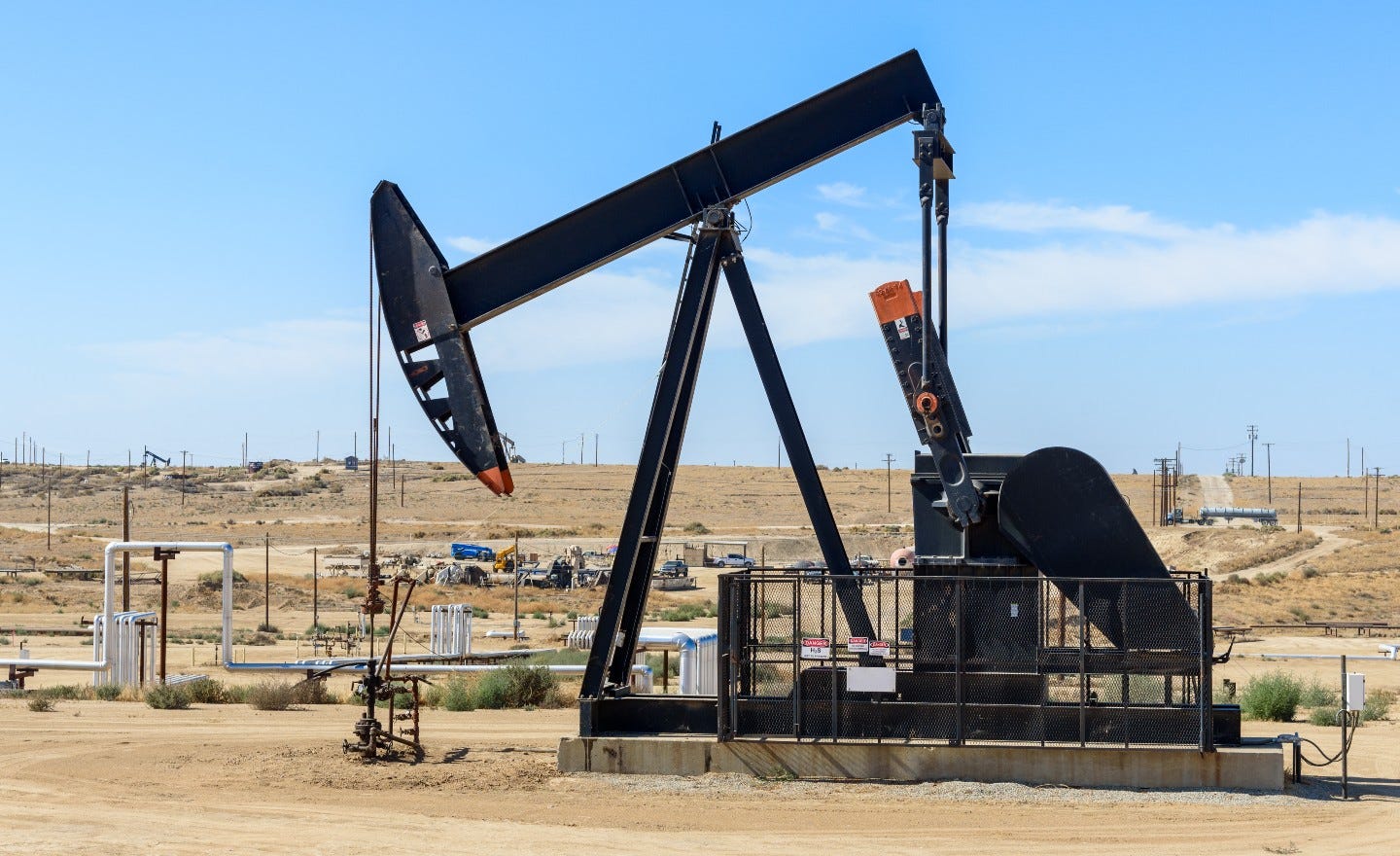 Close up of a pumpjack in a oil field.