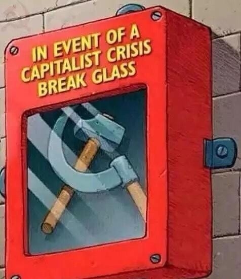Image of a box that says "in event of capitalist crisis, break glass" with a hammer and sickle inside