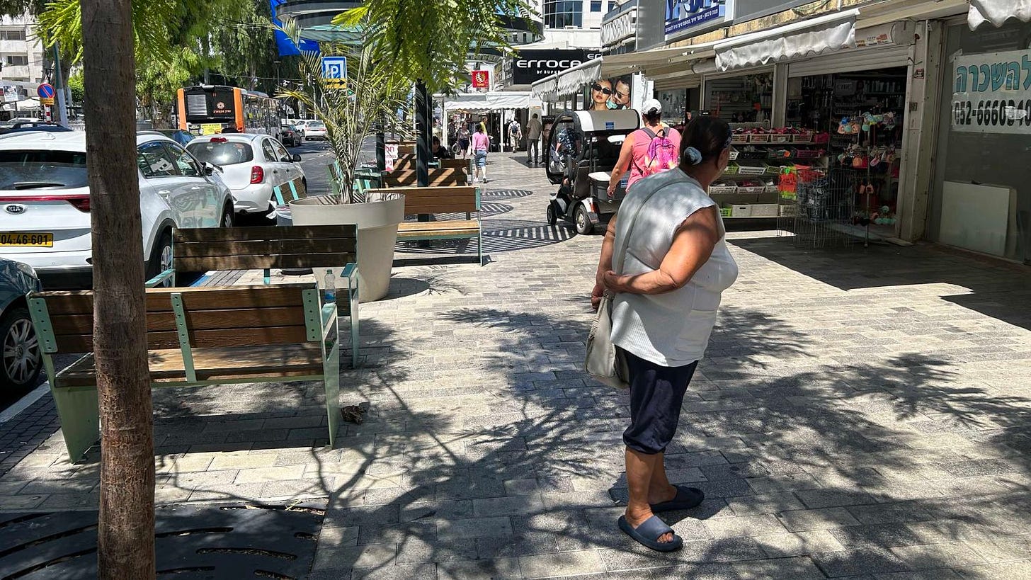 People are seen on the streets of the northern city of Nahariya, Israel on Thursday.