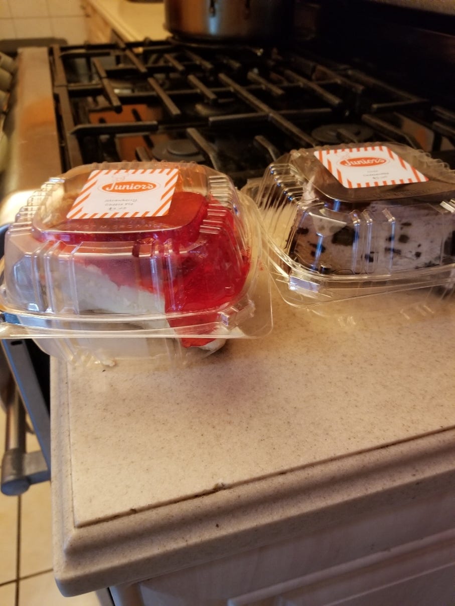 A strawberry cheesecake and right next to it, an Oreo cheesecake, from Junior's.