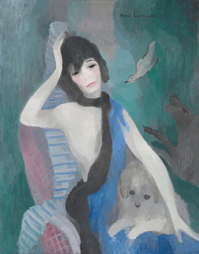 Portrait of a seated woman with dog on lap
