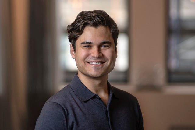 An image of a man with brown hair named Matt Carlstrom