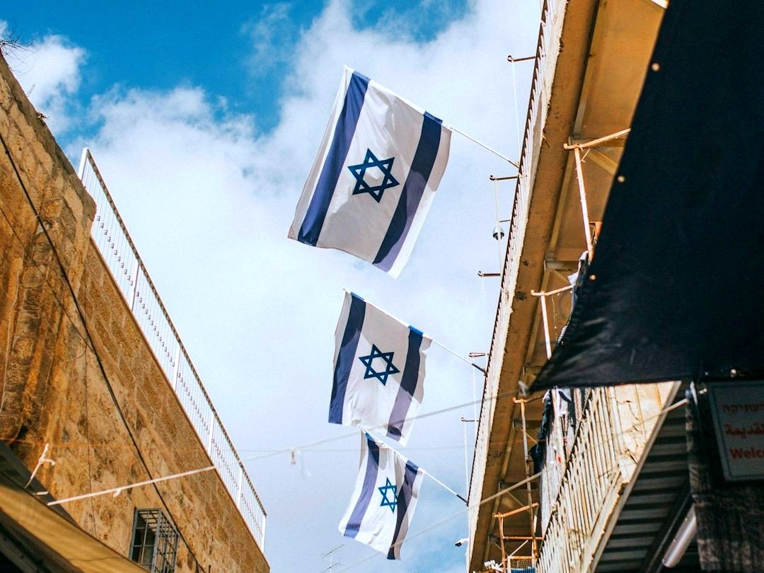 flags hanging on roof during daytime