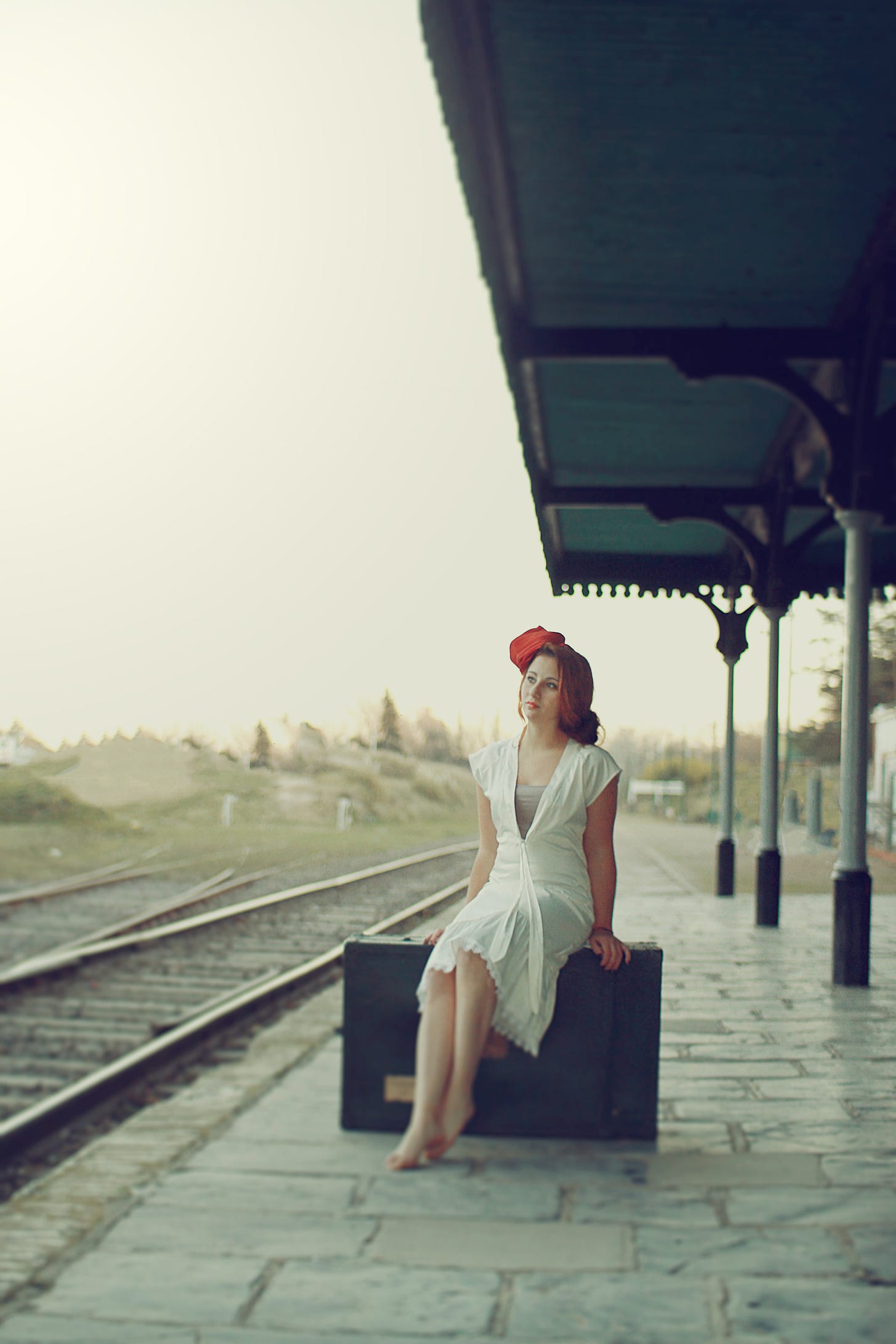 A woman waiting for a train.
