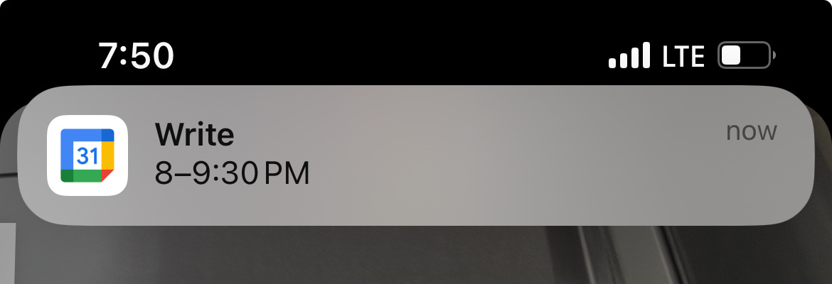 The image shows a notification from Google Calendar on a smartphone screen. The notification is a reminder for a scheduled event labeled "Write," set to take place from 8:00 PM to 9:30 PM. The time displayed on the phone is 7:50 PM, indicating that the event will start soon. The notification appears at the top of the screen, along with the LTE signal strength and battery icon.