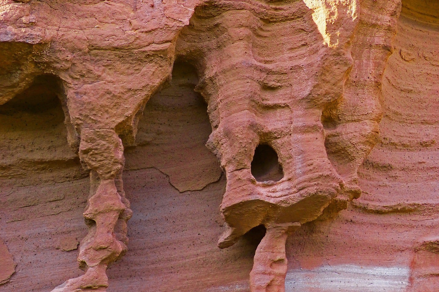 A rose colored rock formation formed by erosion