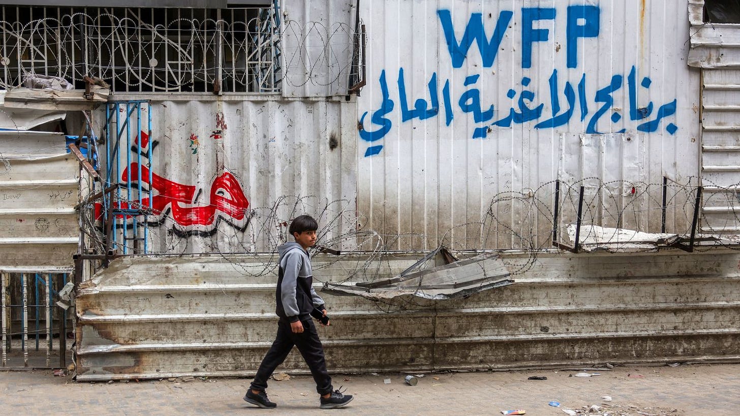 A boy walks past a closed-down bakery that ran out of flour in Gaza City on Tuesday.
